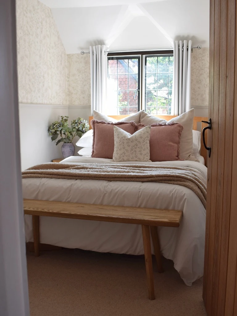 Centered Cottage Bed under an Sloped Ceiling Window