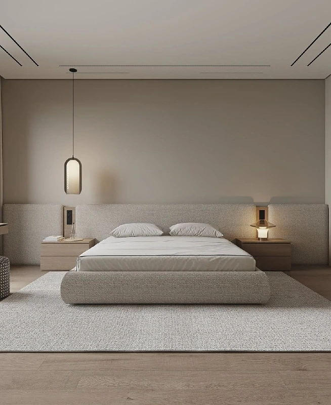 Extended Upholstered Headboard Wall with Asymmetrical Bedside Lighting